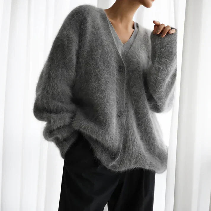 Beige cashmere cardigan with a relaxed, loose fit for layering
