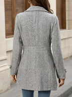 Grey herringbone coat with a waist-defining belt