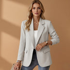 Women's black tailored blazer with a notched lapel and cotton blend finish