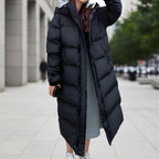 Women's black quilted puffer parka featuring a waterproof hood