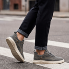 Brown men's retro suede trainers with a lace-up front and cushioned sole