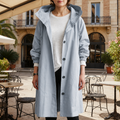 Women's silver mist hooded waterproof trench coat with a tailored fit
