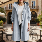 Women's silver mist hooded waterproof trench coat with a tailored fit