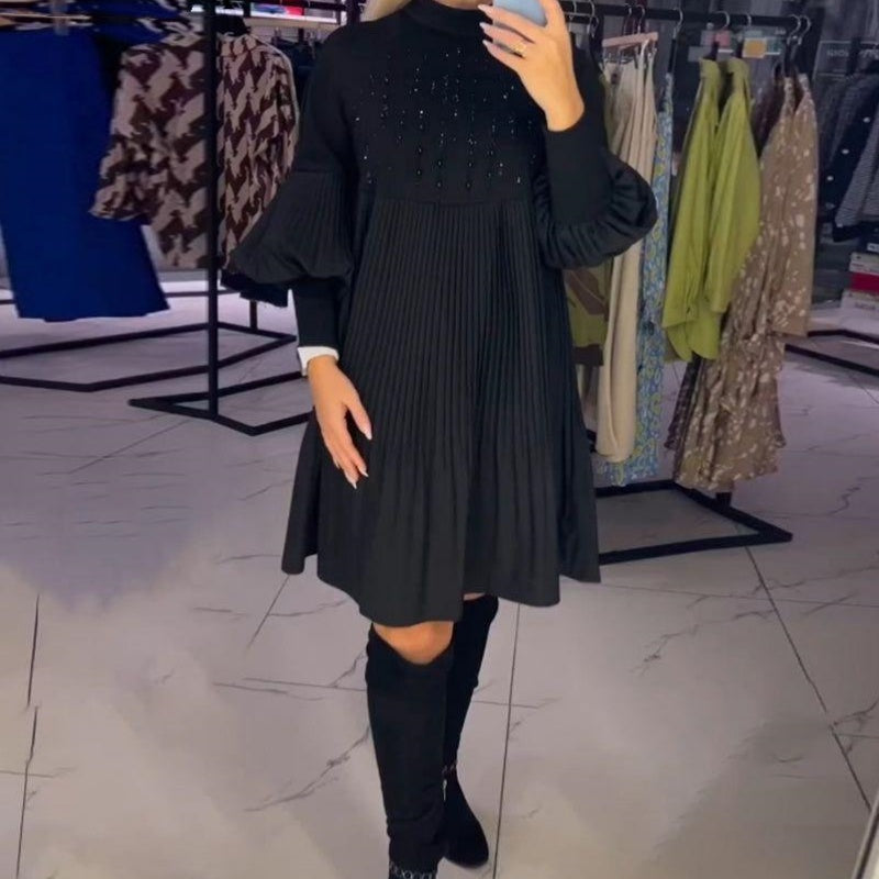 Black pleated midi dress with bishop sleeves, front view