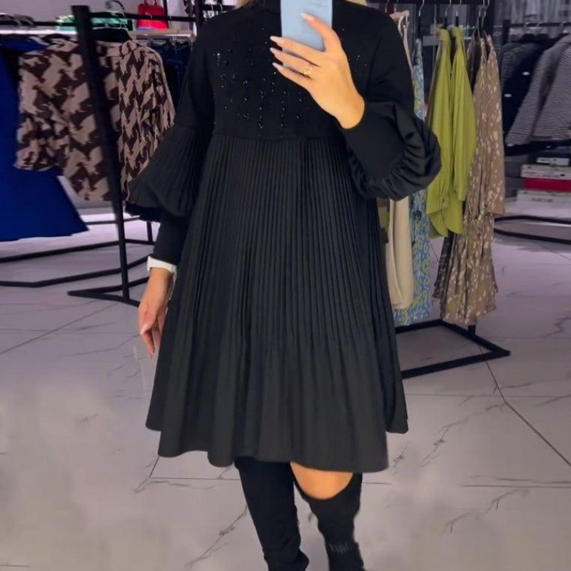 Black pleated midi dress with bishop sleeves, back view