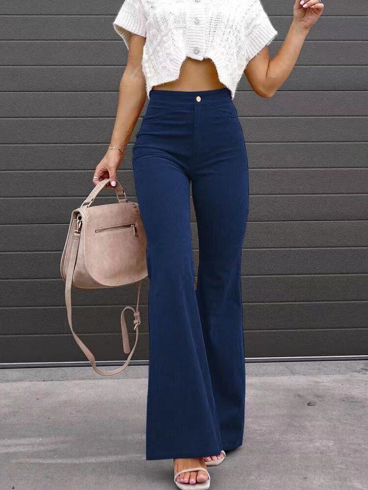 Women's flared corduroy trousers in orange