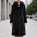 Women's black faux fur hooded coat with a plush, padded finish