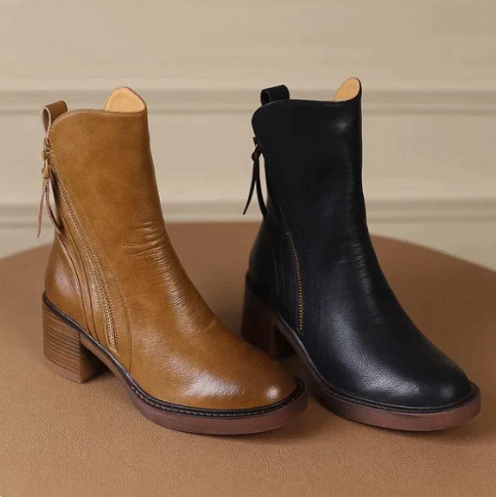 Ankle boots with a block heel and side zip fastening, product still life