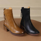 Ankle boots with a block heel and side zip fastening, product still life