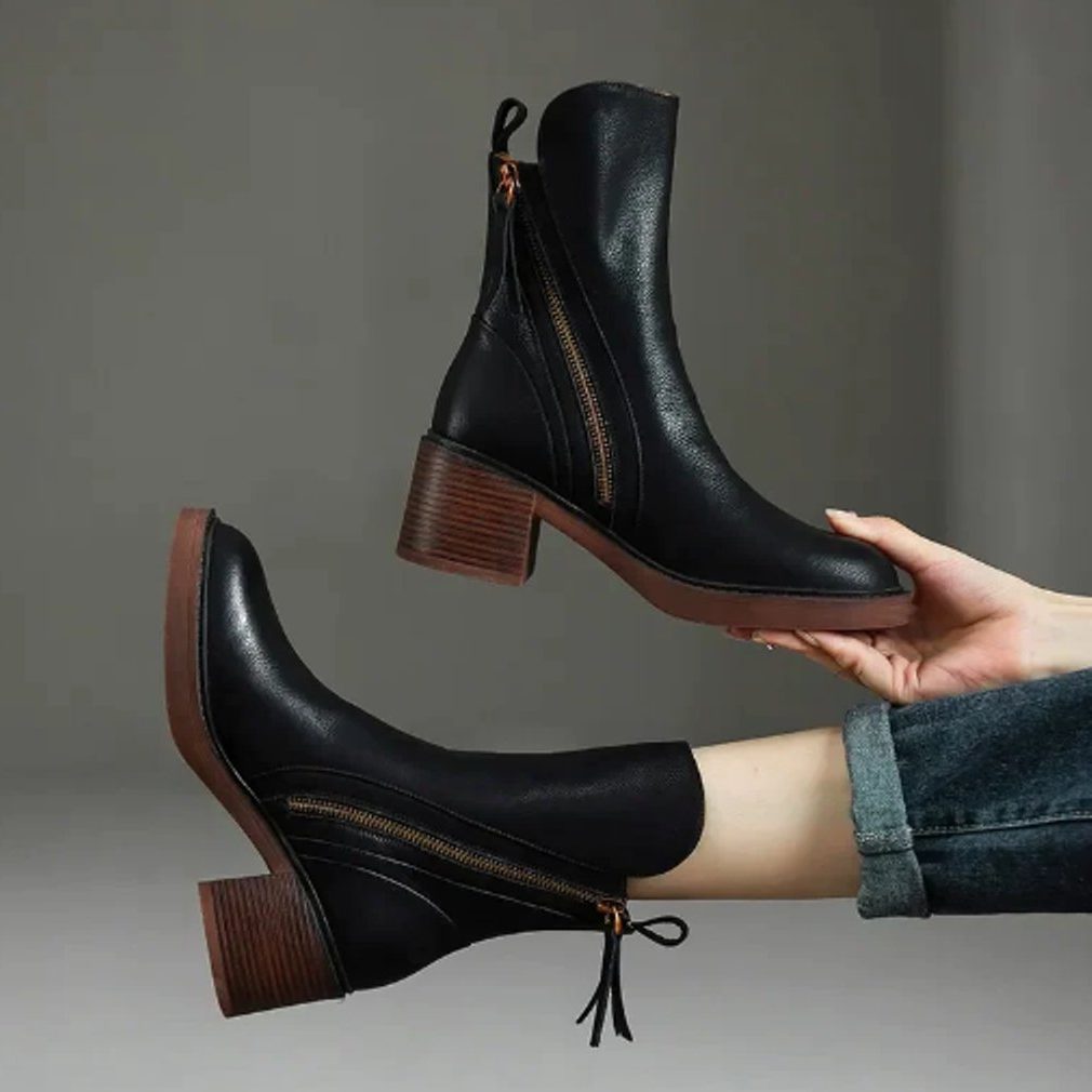 Ankle boots with a block heel and side zip fastening, product still life
