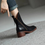 Ankle boots with a block heel and side zip fastening, product still life