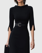 Close-up of split-cuff sleeve on black midi dress