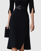 Close-up of belt detail on black midi dress