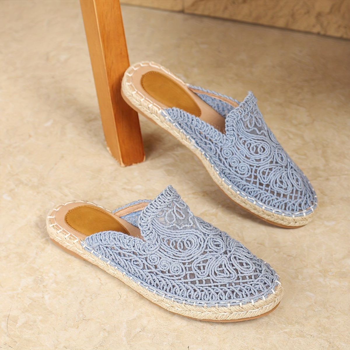 Close-up of round toe on woven slip-on mules