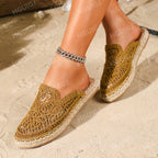 Close-up of stitching detail on woven slip-on mules