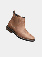 Men's leather Chelsea boots with elastic side panel, product still life