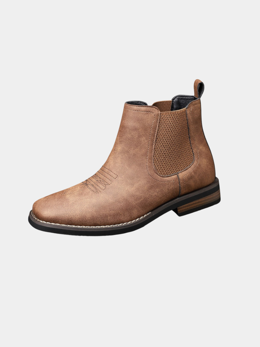 Men's leather Chelsea boots with elastic side panel, product still life