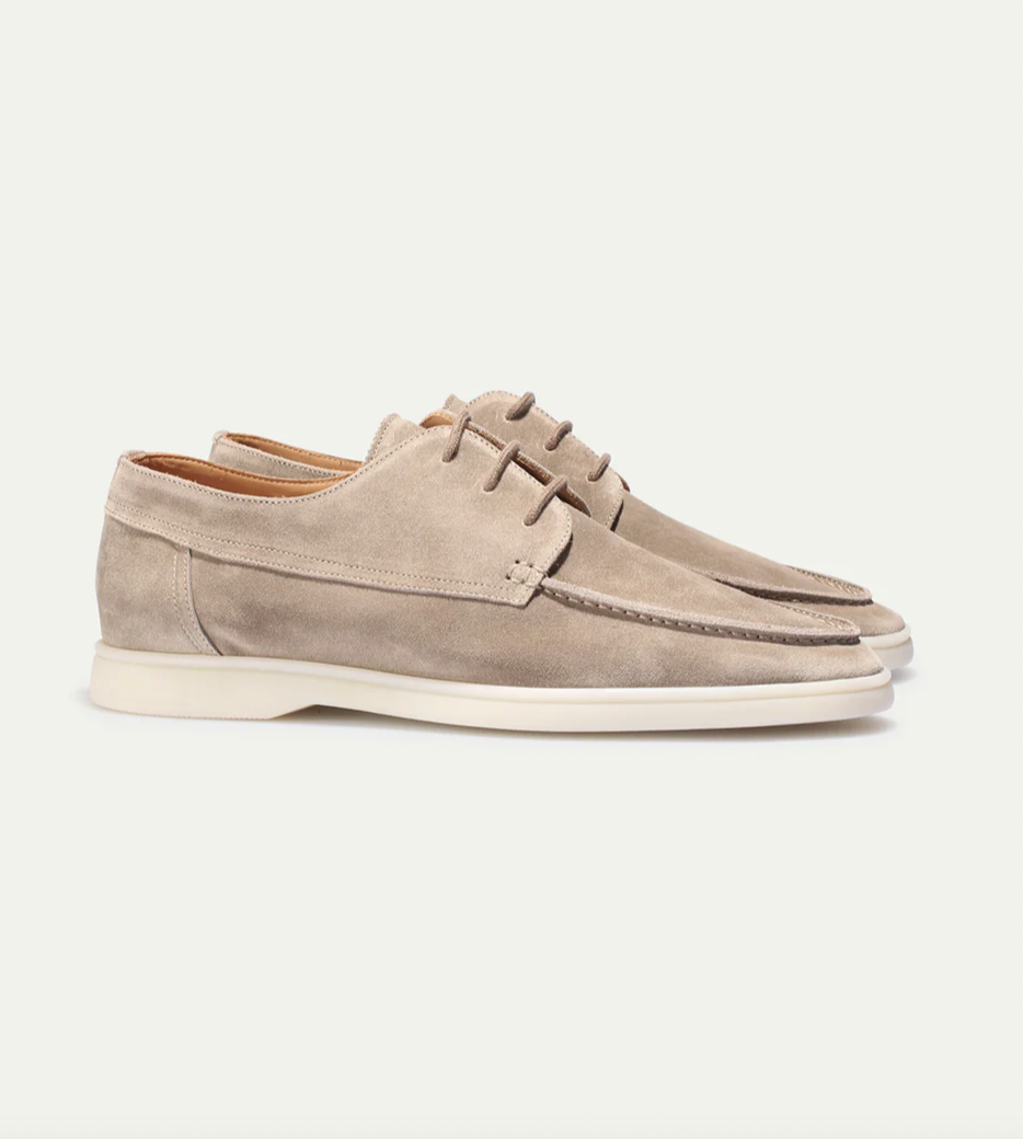 Close-up of stitched seam detail on men's classic loafers