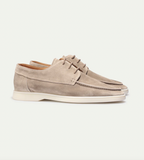 Close-up of stitched seam detail on men's classic loafers
