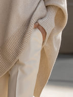 Women's beige relaxed fit knit jumper with a soft, graceful drape