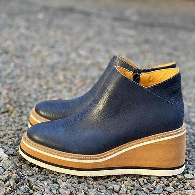 Suede platform wedge ankle boots, product still life