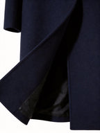 Close-up of belt detail on long trench coat