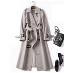Belted long trench coat with lapel collar, product still life