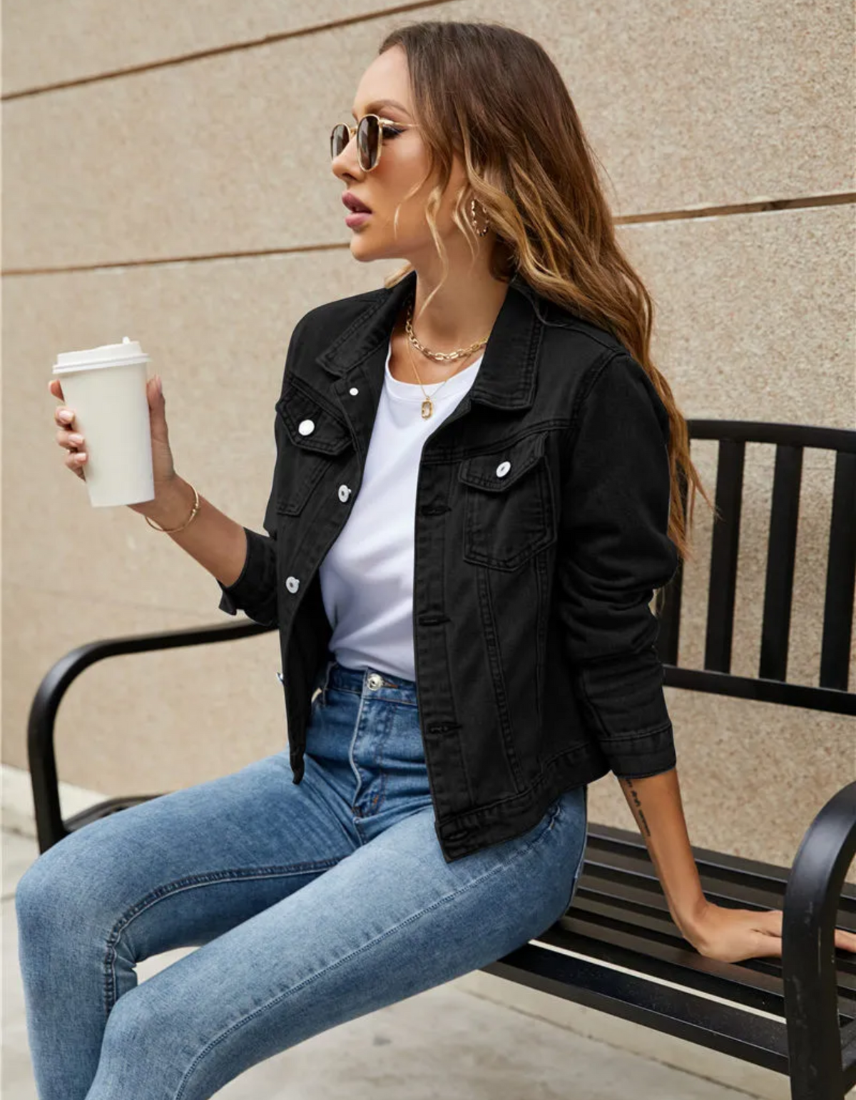 Women's classic cropped denim jacket with chest pockets and buttons, back view