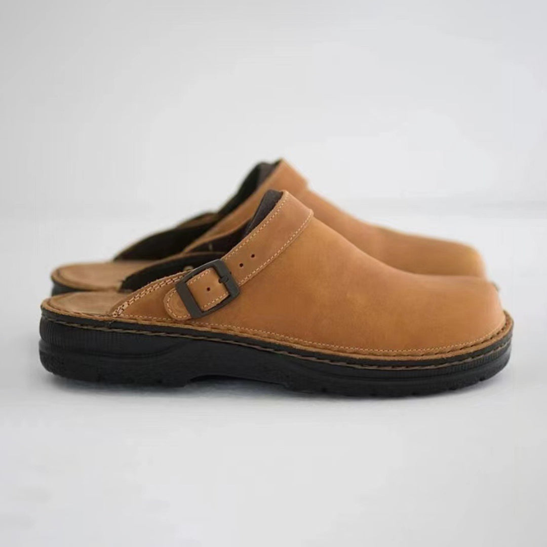 Brown men's faux leather moccasin slippers with a non-slip sole