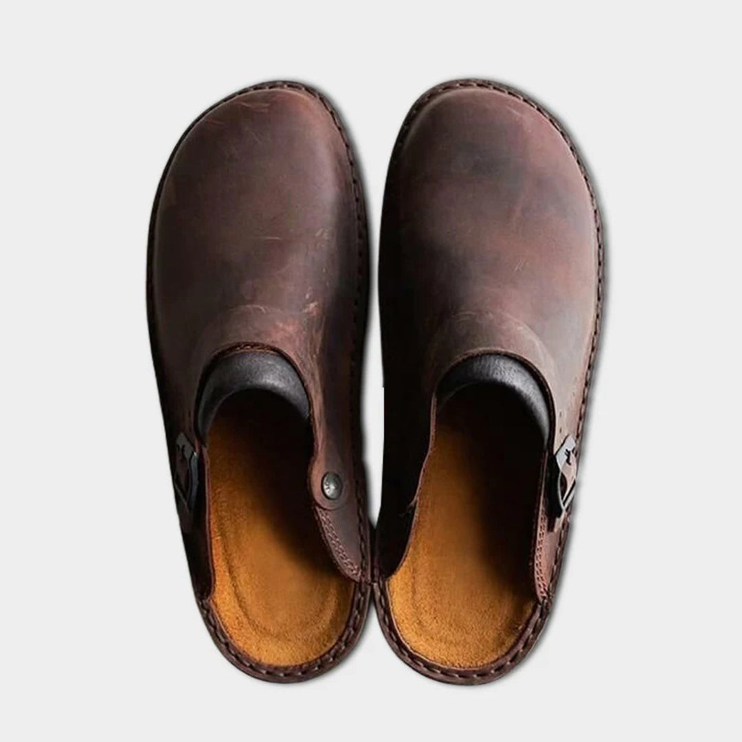 Brown men's faux leather moccasin slippers with a non-slip sole