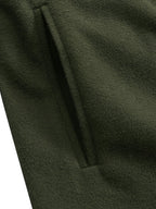Close-up of button fastening on long winter coat