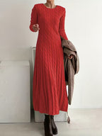Women's red cable knit maxi jumper dress with long sleeves and a round neck