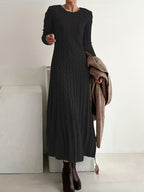 Women's black cable knit maxi jumper dress with long sleeves and a round neck