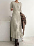 Women's cream cable knit maxi jumper dress with long sleeves and a round neck
