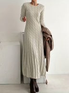 Women's cream cable knit maxi jumper dress with long sleeves and a round neck