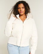 Close-up of quilted panel stitching and front zip on puffer jacket