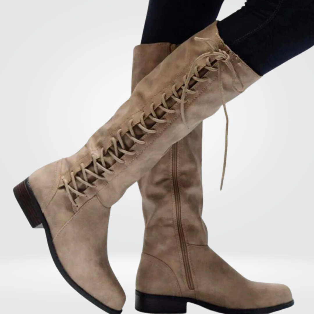 Women's black knee high boots with a block heel in faux leather