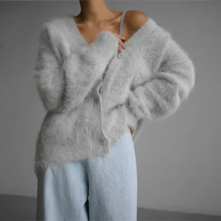 Beige cashmere cardigan with a relaxed, loose fit for layering