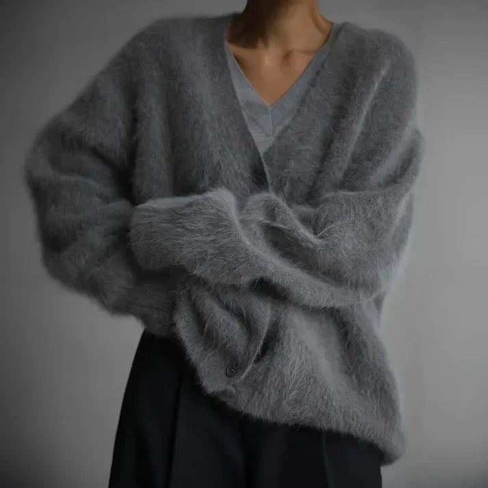 Beige cashmere cardigan with a relaxed, loose fit for layering