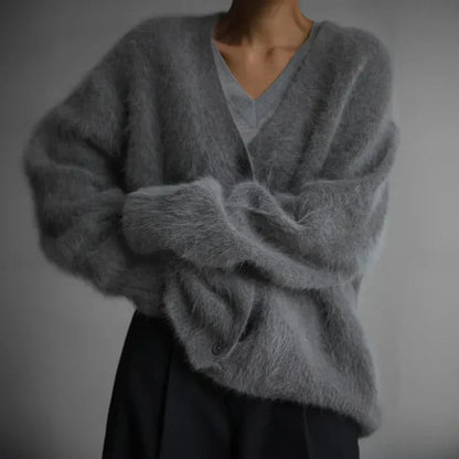 Beige cashmere cardigan with a relaxed, loose fit for layering