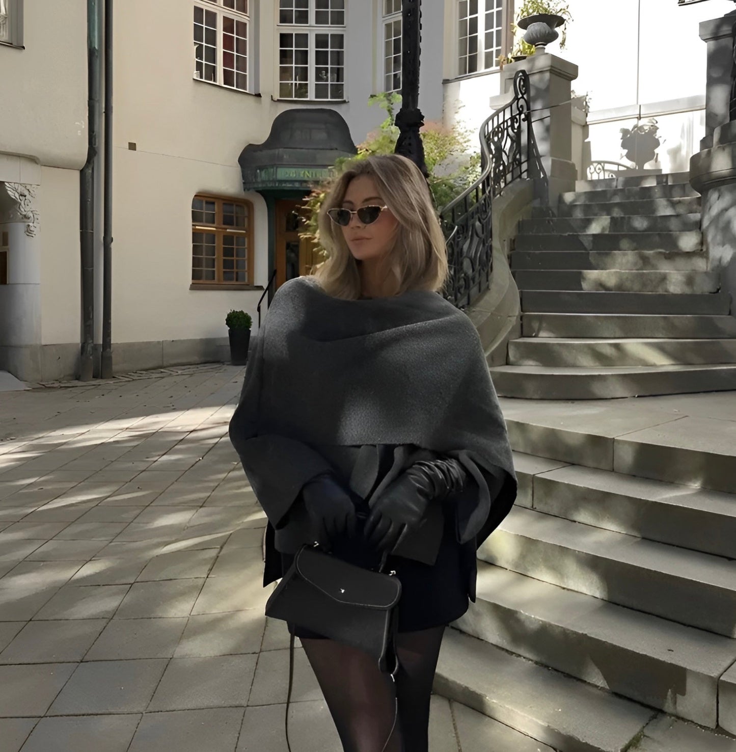 Dark grey asymmetric wool blend poncho with a slip-on silhouette for autumn layering
