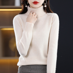 Light blue cashmere roll neck jumper with a cosy, elegant finish for autumn layering