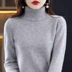 Light blue cashmere roll neck jumper with a cosy, elegant finish for autumn layering