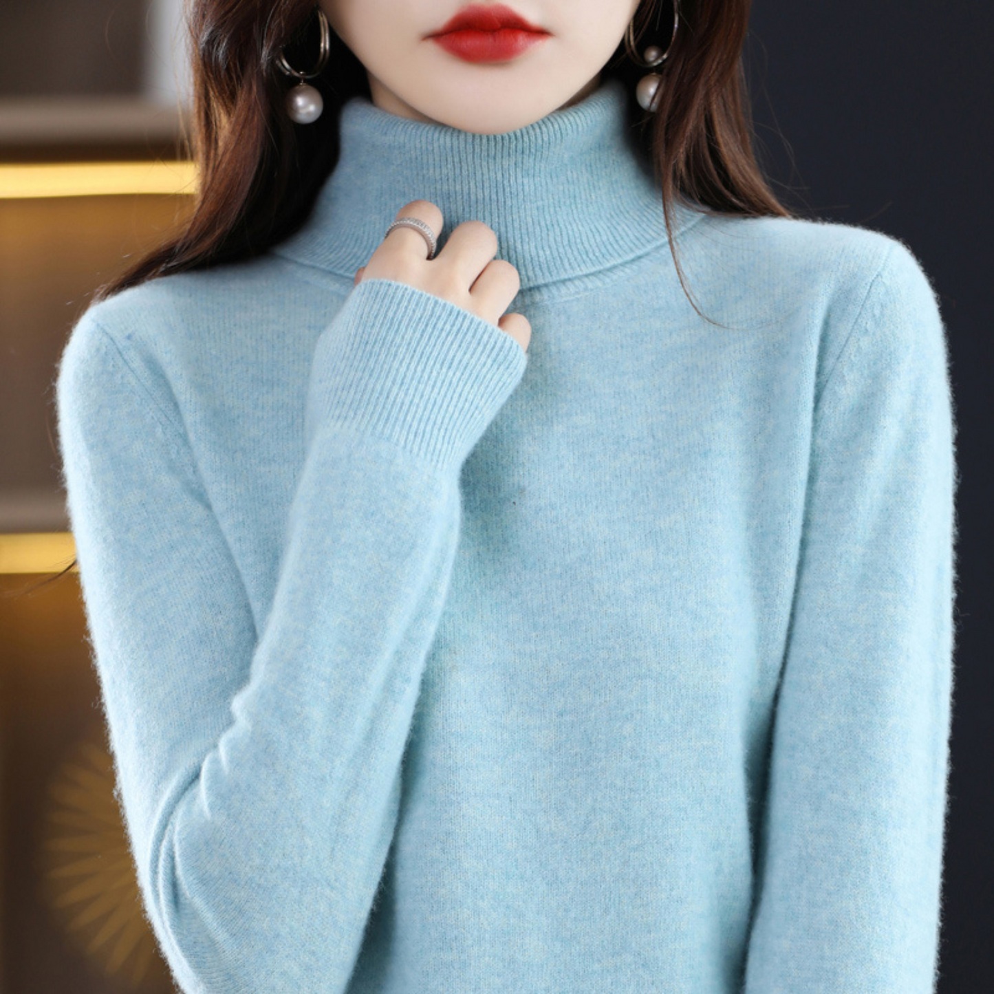 Black cashmere roll neck jumper with a cosy, elegant finish for autumn layering