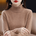 Light blue cashmere roll neck jumper with a cosy, elegant finish for autumn layering