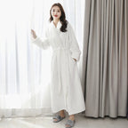 Women's orange fleece dressing gown with a soft shawl collar and tie belt