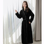 Women's white fleece dressing gown with a soft shawl collar and tie belt