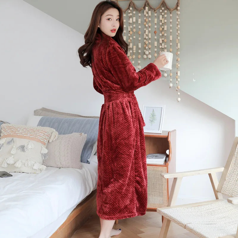 Women's white fleece dressing gown with a soft shawl collar and tie belt