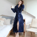 Women's purple fleece dressing gown with a soft shawl collar and tie belt