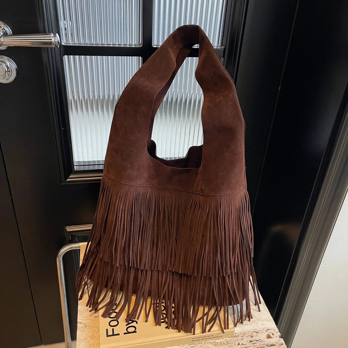 Faux suede fringe shoulder tote bag, product still life